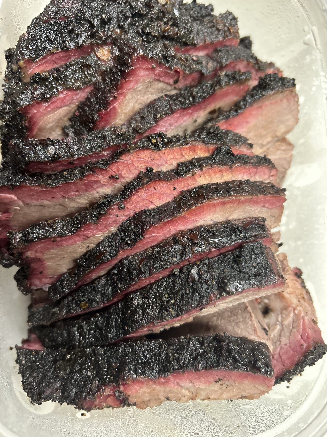 Sliced brisket with a dark Black Heart bark
