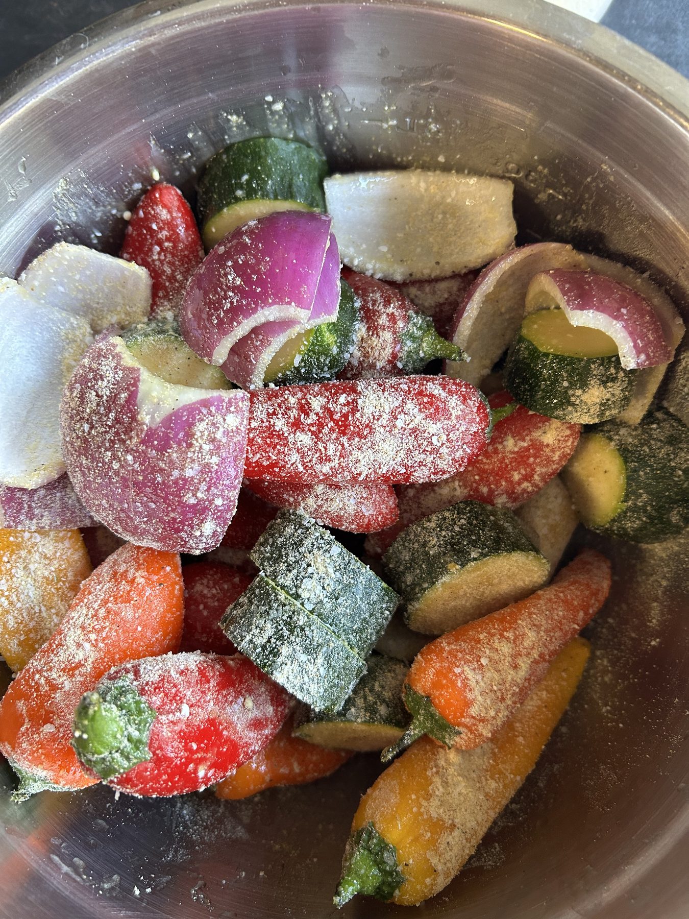 Mixed peppers and onion coated with Ivory All Purpose before grilling