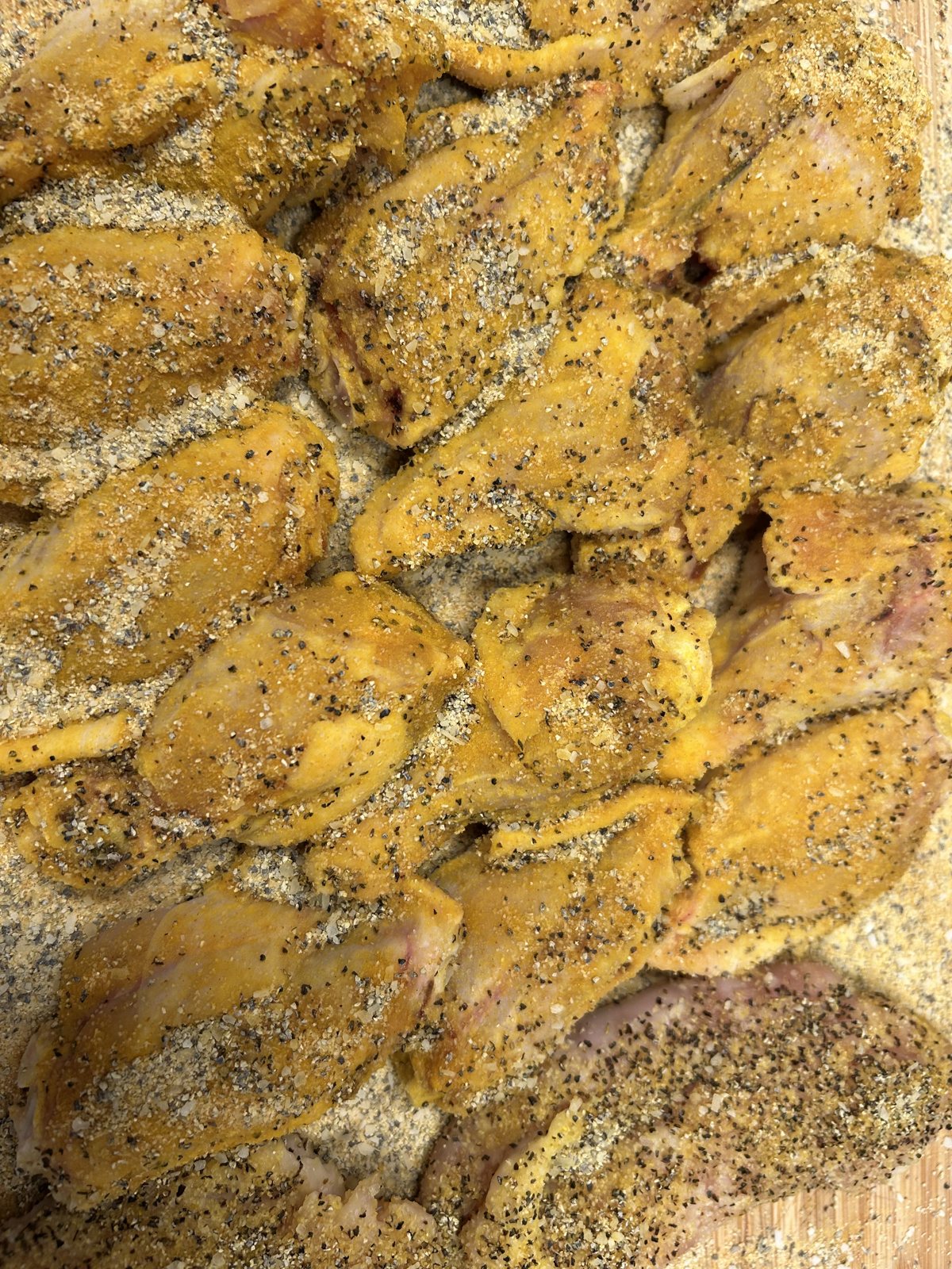 Chicken wings coated with Lemon Pepper Seasoning before cooking