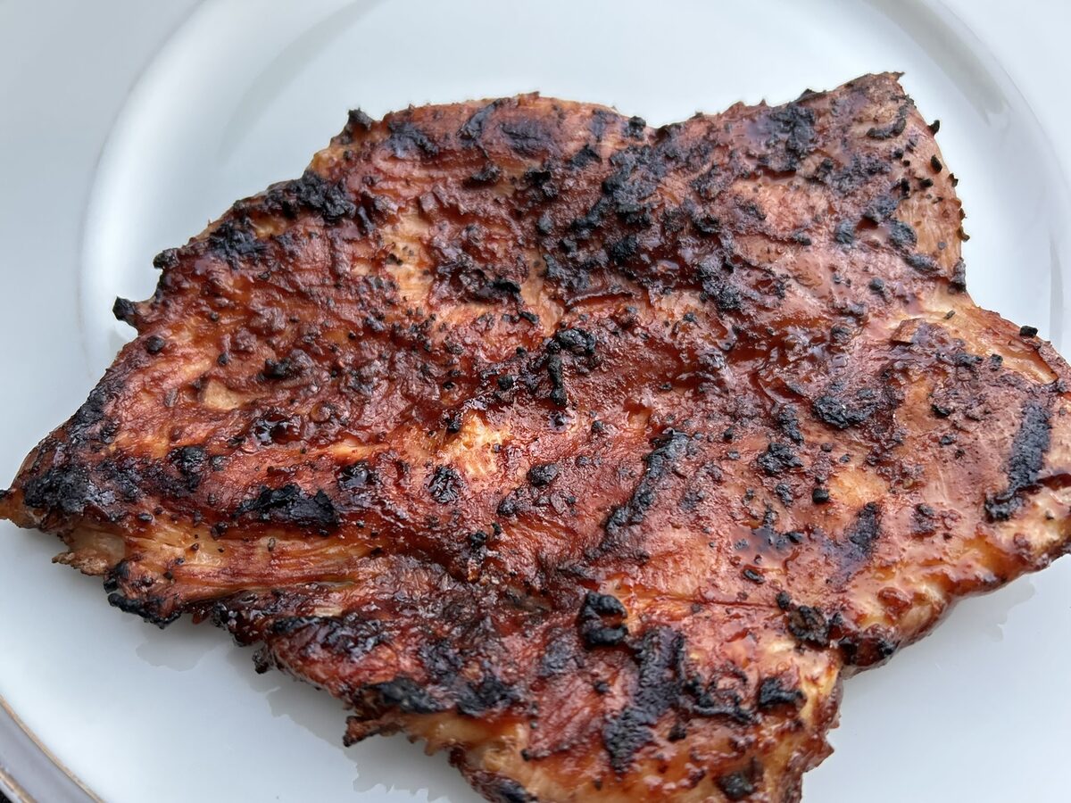 Cooked Nashville Hot chicken, crisped and plated