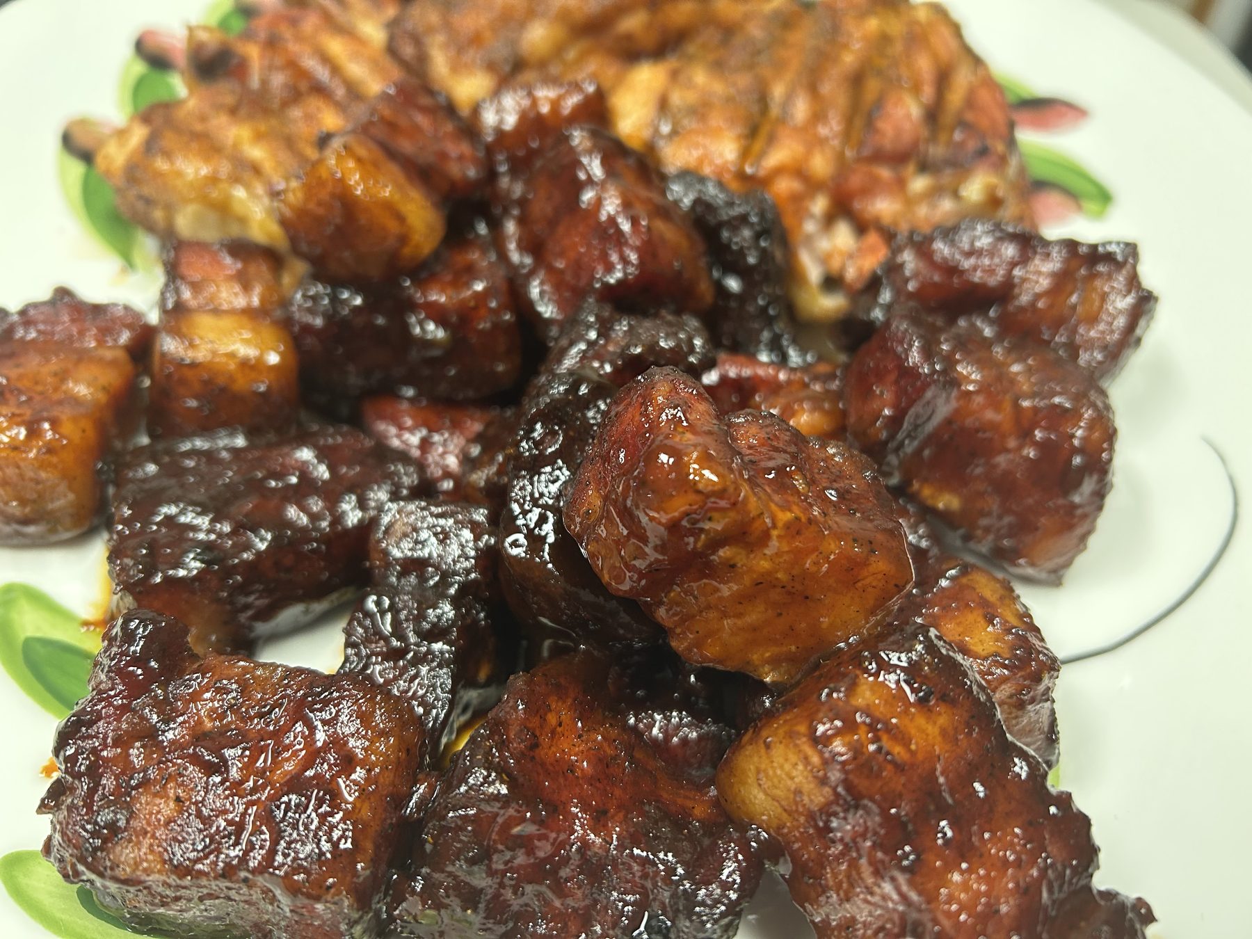 Sticky pork belly burnt ends on a platter