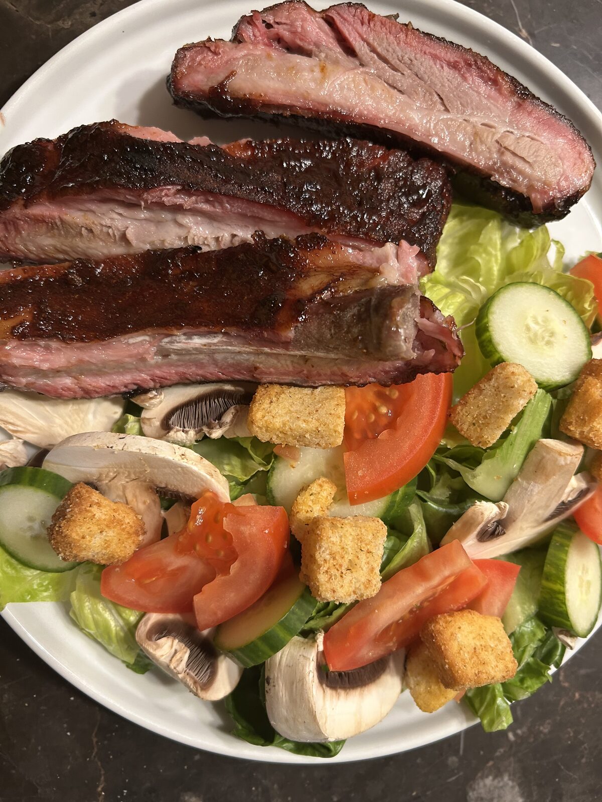 Ribs plated with garden salad