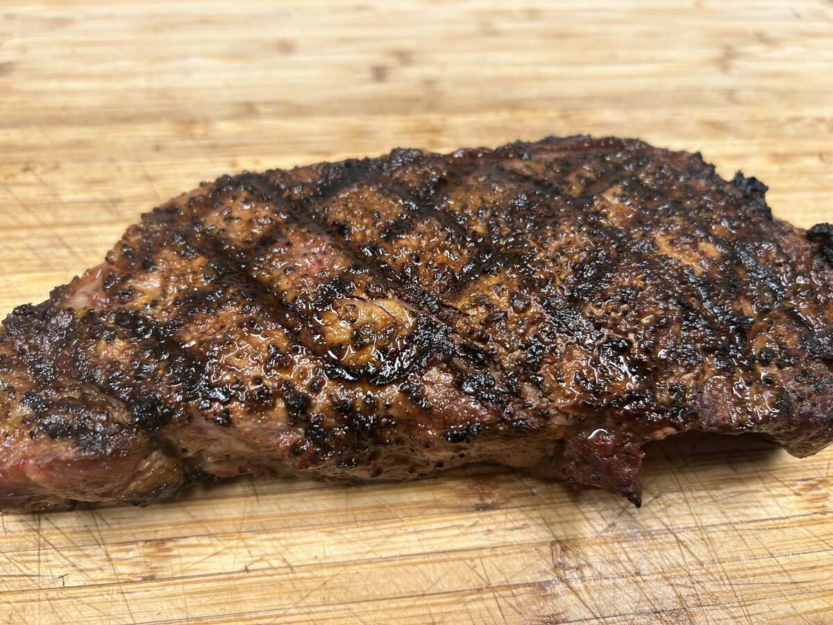 Grilled steak with crosshatched grill marks and a dark Texas Beef Dust crust